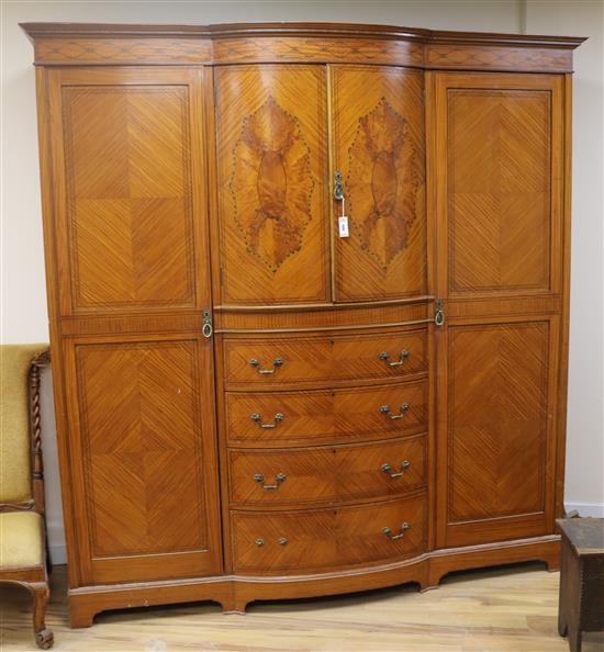 An Edwardian marquetry inlaid satinwood breakfront wardrobe, W.7ft D.2ft 6in. H.7ft 2in.